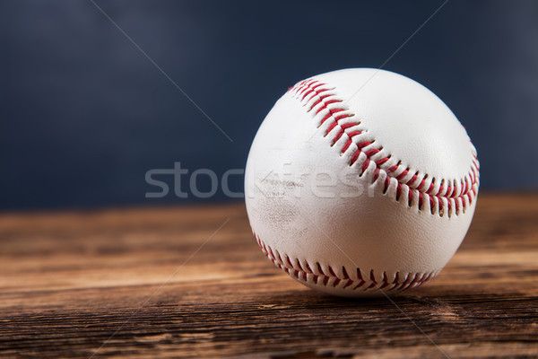 Baseball ball on wooden table Stock photo © BrunoWeltmann