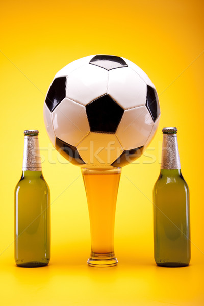 Chilled beer on yellow background Stock photo © BrunoWeltmann