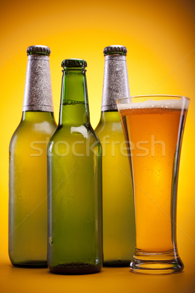 Chilled beer on yellow background Stock photo © BrunoWeltmann