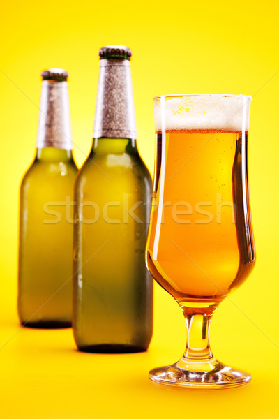 Cerveza amarillo bar botella oro burbujas Foto stock © BrunoWeltmann