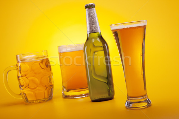 Chilled beer on yellow background Stock photo © BrunoWeltmann