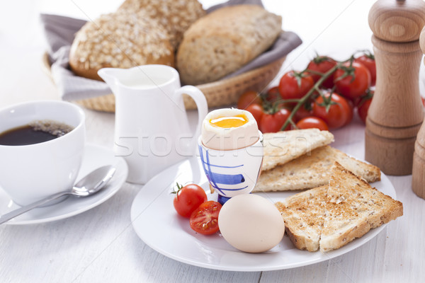 Soft-boiled egg in the morning with toast. In the background of  Stock photo © BrunoWeltmann
