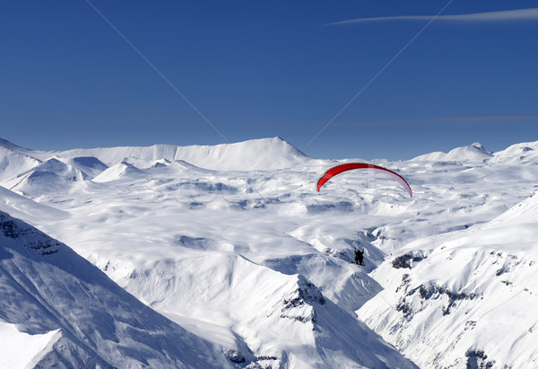 Sky gliding in snowy mountains Stock photo © BSANI