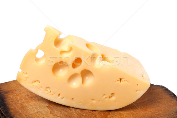 Piece of cheese on old wooden kitchen table Stock photo © BSANI