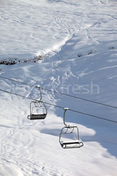 Two chair-lift with snowdrift and off-piste slope in sun morning Stock photo © BSANI