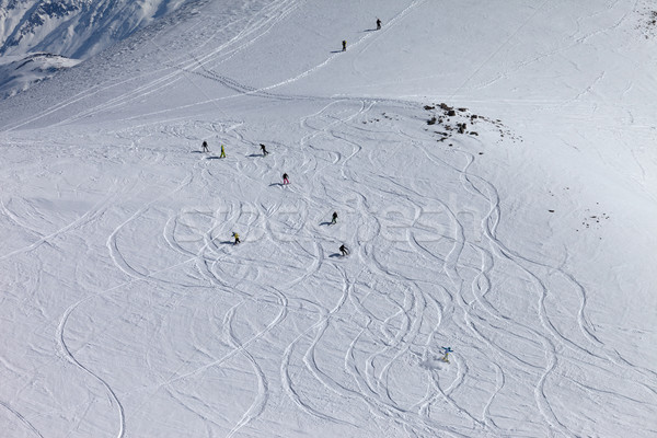 Snowboarders and skiers downhill on off piste slope. Stock photo © BSANI