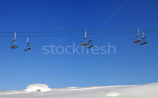 Chair-lift and blue clear sky at sun day Stock photo © BSANI