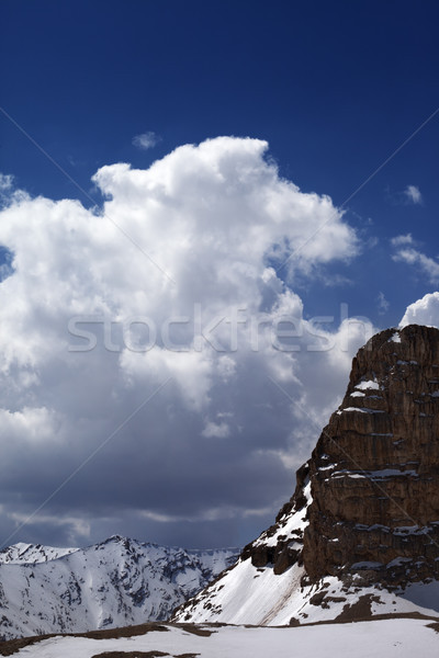 Snowy rocks in clouds Stock photo © BSANI
