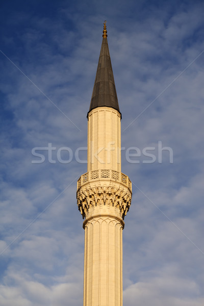 Minaret of mosque against sky with clouds Stock photo © BSANI