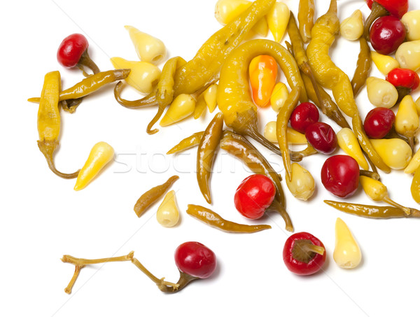 Mix of hot pickled peppers on white background Stock photo © BSANI