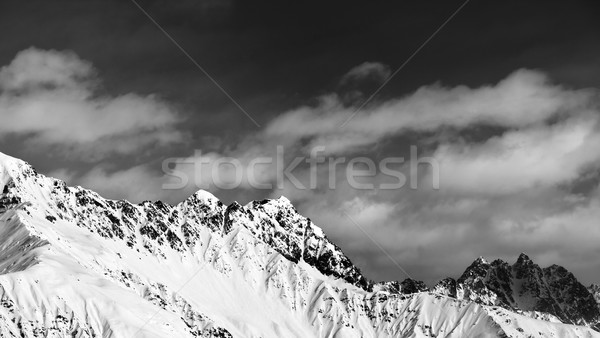 Black and white panoramic view on snow mountains at sun day Stock photo © BSANI