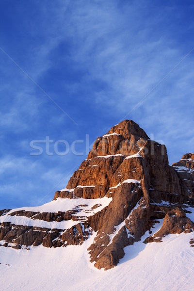 Snowy sunlight rocks at sunrise Stock photo © BSANI