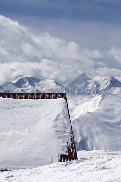 Roof of hotel in snow and ski slope Stock photo © BSANI