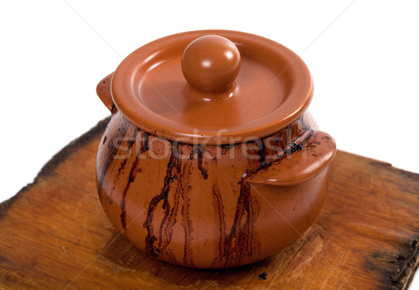 Dirty ceramic pot on old wooden kitchen board Stock photo © BSANI