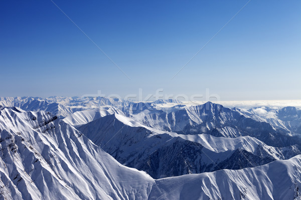 Snowy rocks and blue sky in nice sun day, view from off piste sl Stock photo © BSANI