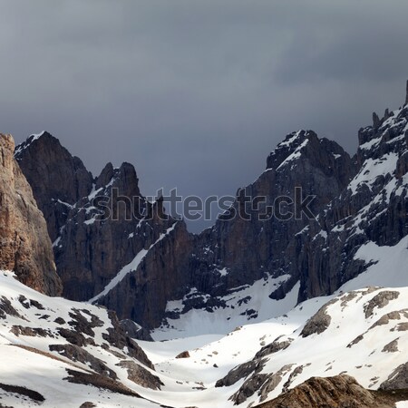 Snowy rock and sky with clouds Stock photo © BSANI