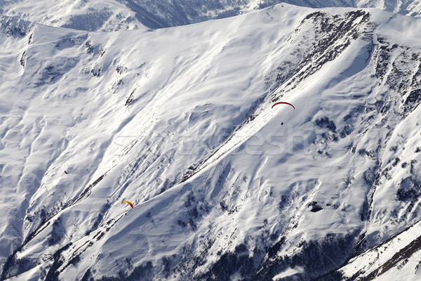 Paragliders of snowy mountains Stock photo © BSANI
