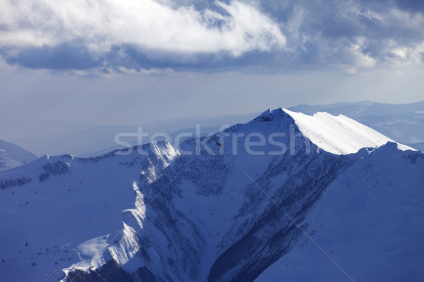 Winter mountains and helicopter in evening Stock photo © BSANI