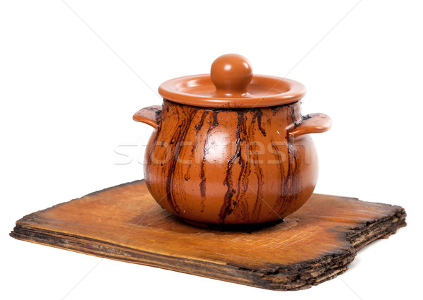 Dirty ceramic pot on old kitchen board Stock photo © BSANI