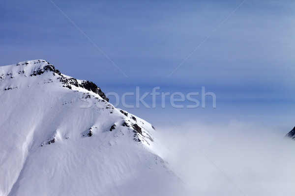 Stock photo: Snowy rocks in fog