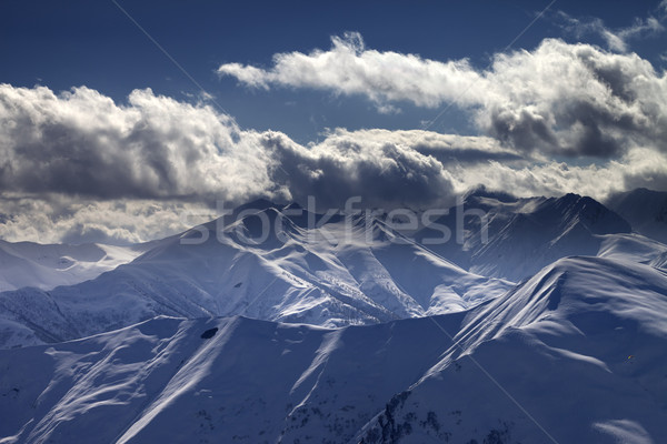 Stock fotó: Este · hegyek · napfény · felhők · kilátás · sí