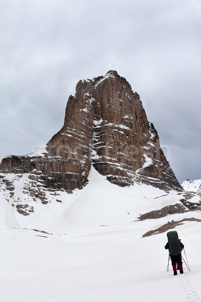 Hikers at snowy cloudy mountains Stock photo © BSANI