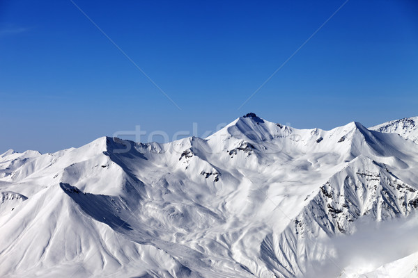 Stock photo: Snowy mountains and blue sky