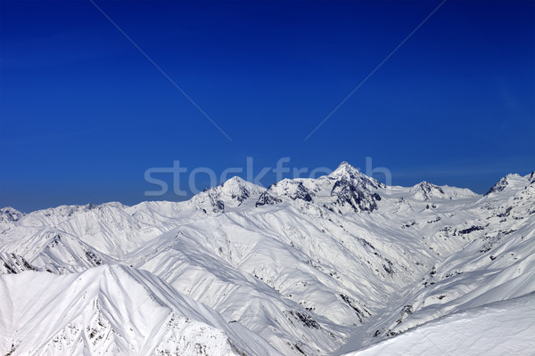 Snowy mountain peaks in sun day Stock photo © BSANI