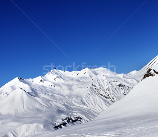 Stock photo: View on ski slope and beautiful mountains at sun day