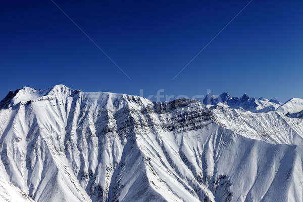 Stock photo: Snowy winter rocks in sun day