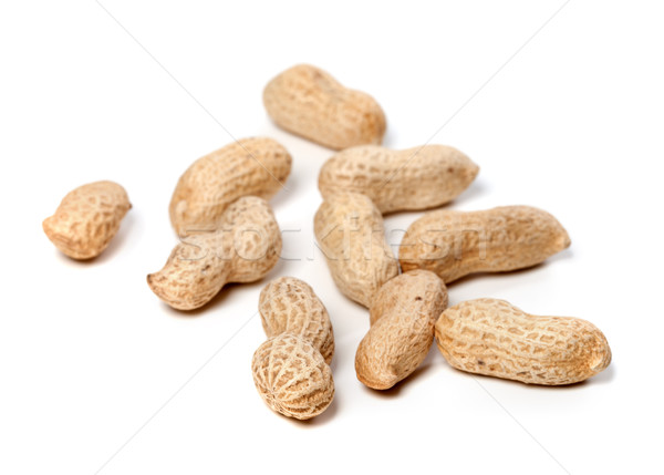 Unpeeled peanuts. Selective focus. Stock photo © BSANI