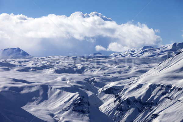 Snowy plateau and blue sky with clouds at nice evening Stock photo © BSANI