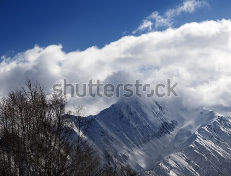 Stock photo: Winter mountains in clouds at nice day