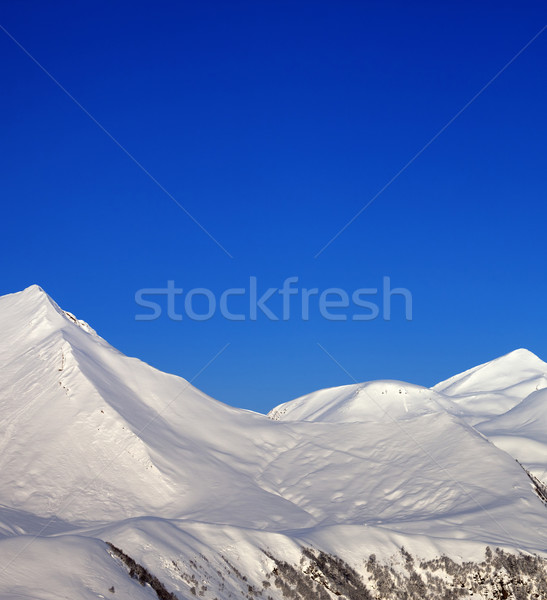 Snowy mountains and blue clear sky at nice morning Stock photo © BSANI