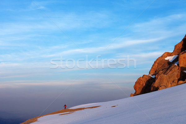 Hiker in sunrise mountains Stock photo © BSANI