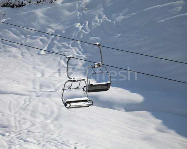 Two chair-lift with snowdrift in sun morning Stock photo © BSANI