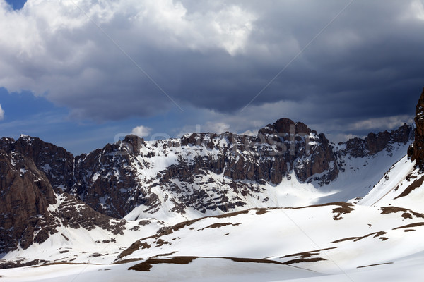 Snow mountains and sky with clouds Stock photo © BSANI