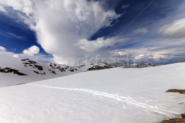 Snowy mountains and sky with clouds Stock photo © BSANI