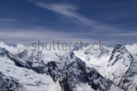 Kaukázus hegyek felhő tájkép hó tél Stock fotó © BSANI