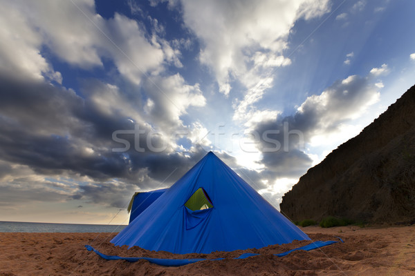 Conical tent on summer beach in evening Stock photo © BSANI