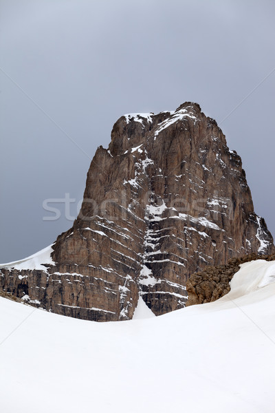 Snow rocks and gray sky Stock photo © BSANI
