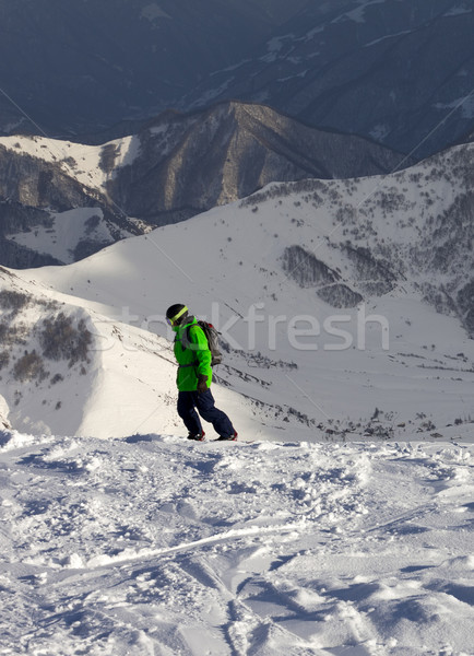 Snowboarder sole sera caucaso montagna Foto d'archivio © BSANI