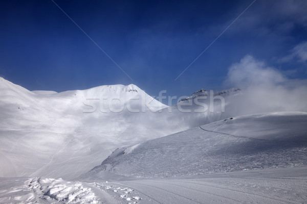 Ski slope with snowmobile trail in nice day Stock photo © BSANI