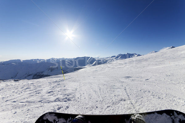 Snowboarder resting on ski slope Stock photo © BSANI