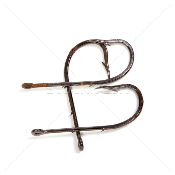 Letter B composed of old rusty fish hooks Stock photo © BSANI