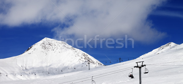 Stock photo: Panoramic view on chair-lift and ski slope at sun day