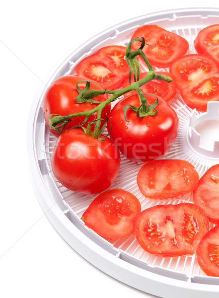 Fresh tomato on food dehydrator tray Stock photo © BSANI
