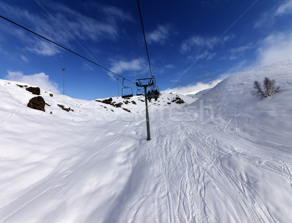 Chair-lift and off-piste slope in sun day Stock photo © BSANI