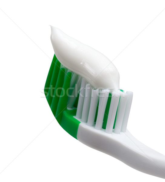 Green toothbrush with toothpaste Stock photo © BSANI