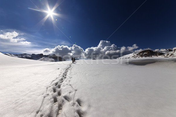 Hikers on snow mountains Stock photo © BSANI